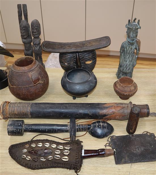 A West African Benin style bronze and other ethnographical carvings, tools and weapons